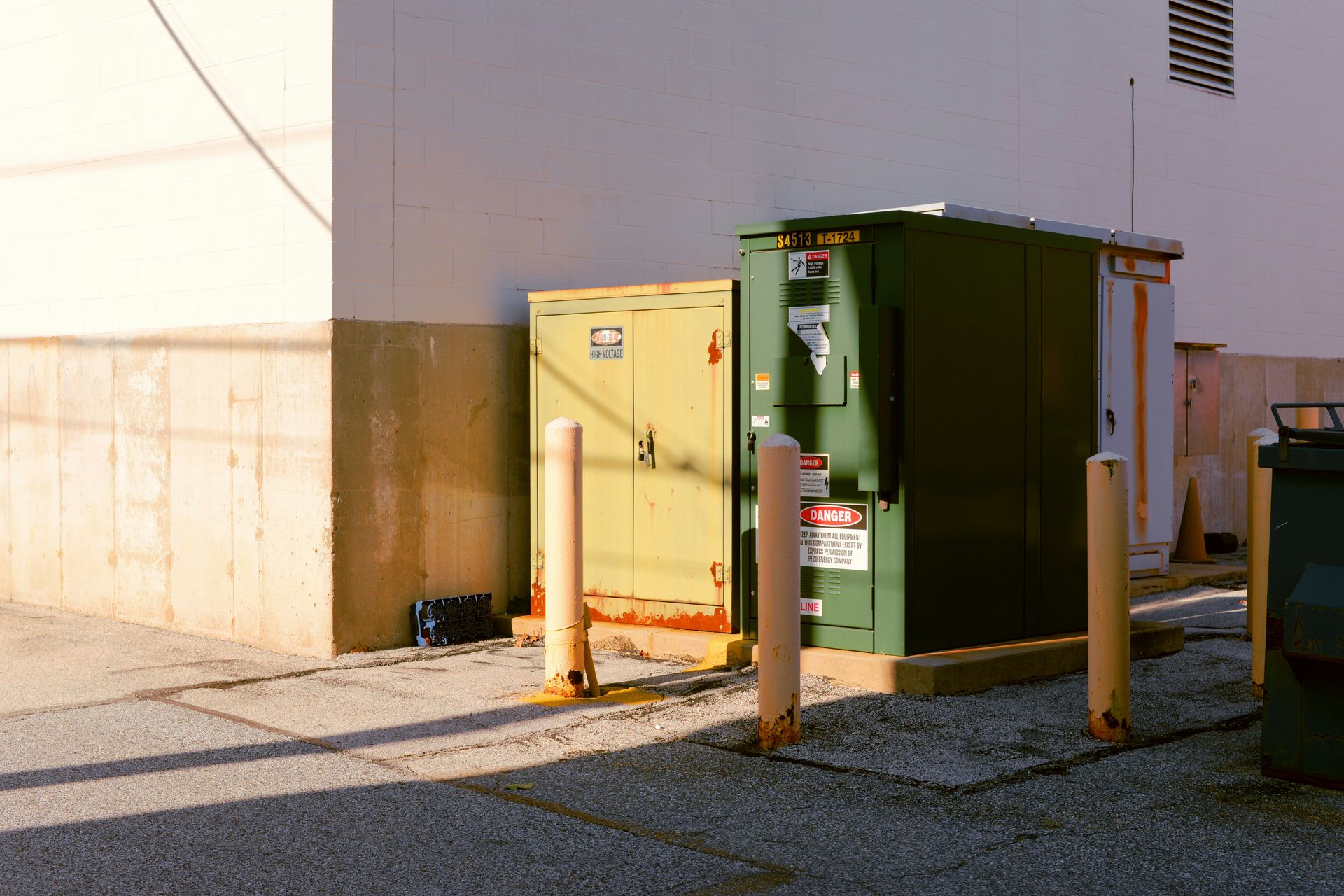 a green box on a concrete surface